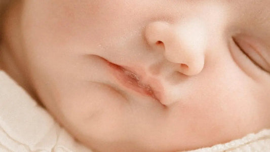 Peacefully sleeping baby illustrating mouth taping for sleep benefits.